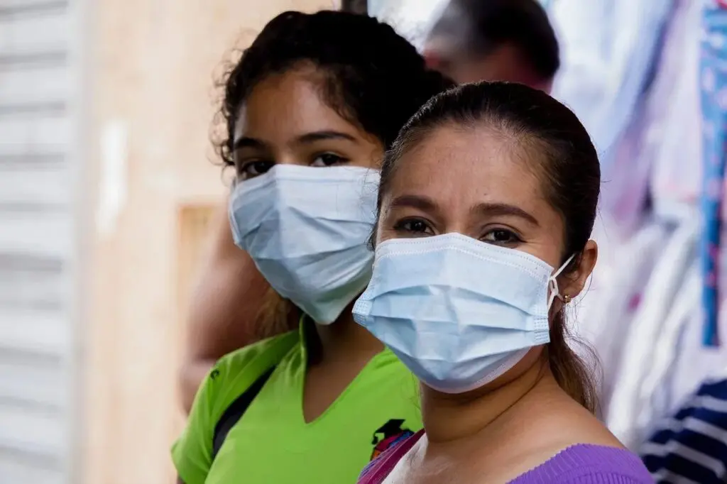 Two Women in Disposable Masks