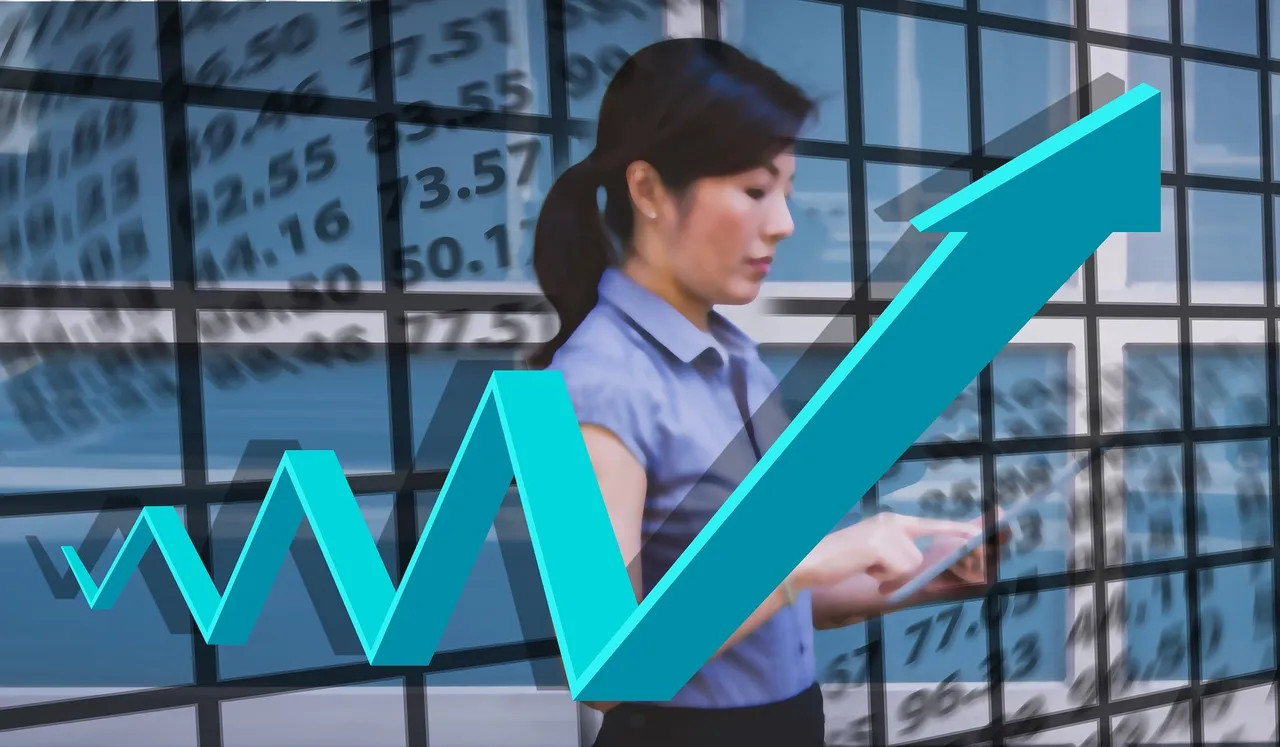 A woman working on her tablet with a zigzag arrow going upward