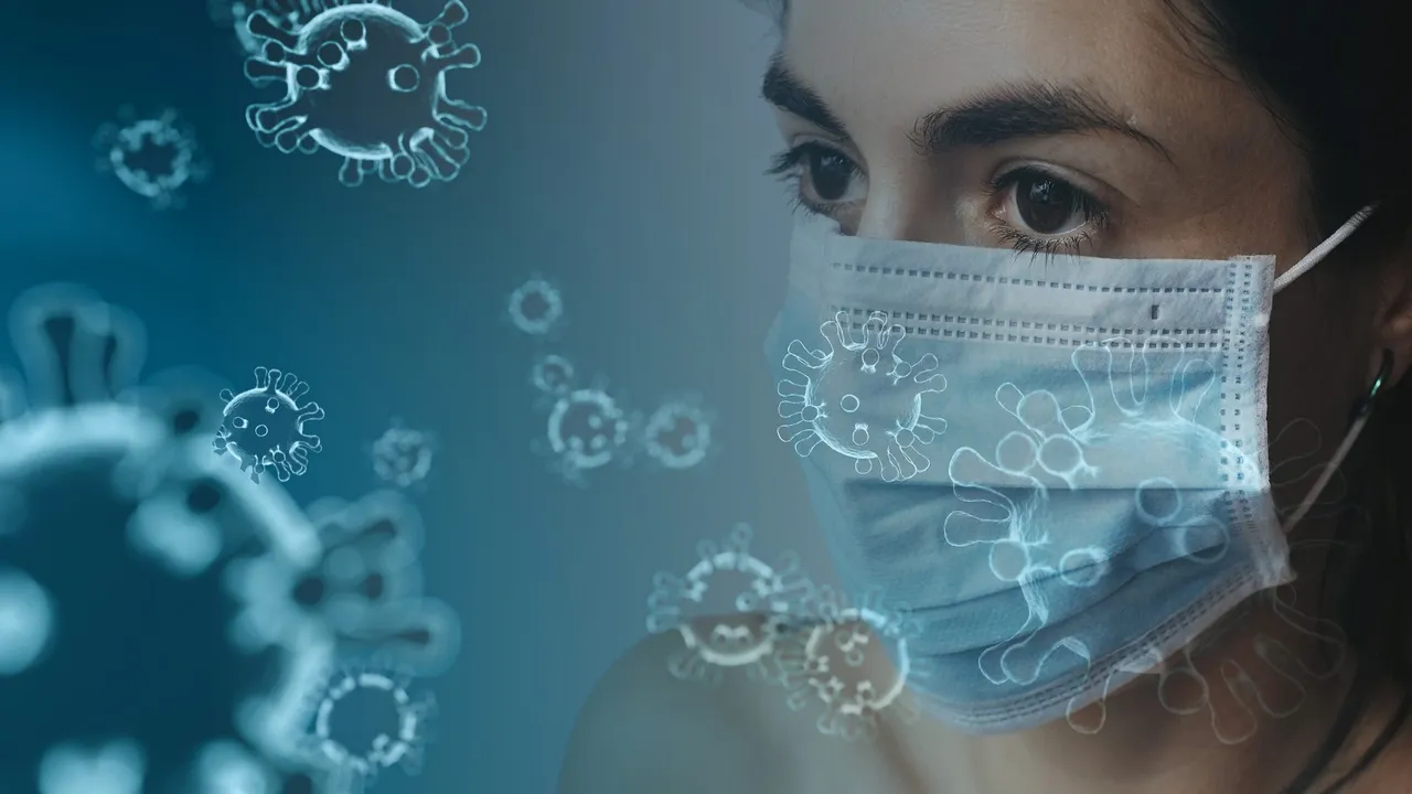 A woman wearing a blue mask with virus cells floating in the air